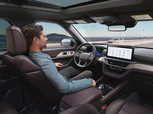 2025 Ford Explorer view of man in driver seat with hands off of wheel while vehicle is in BlueCruise mode